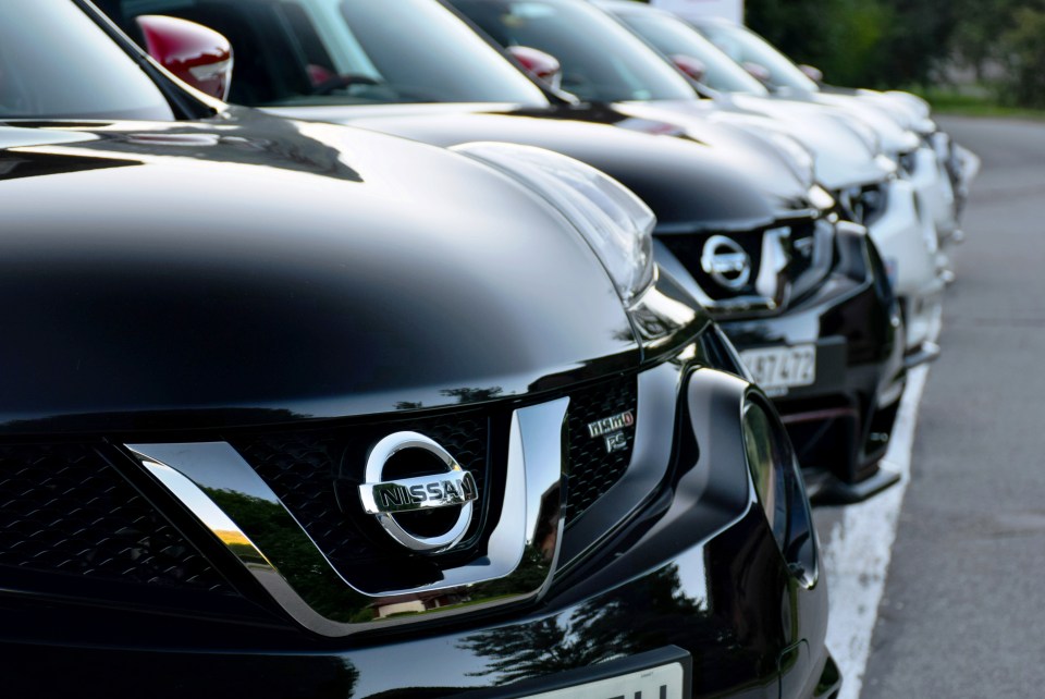 Row of Nissan Juke cars in a parking lot.
