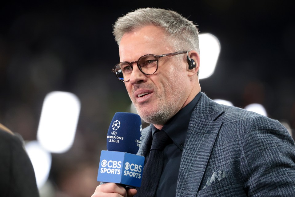Jamie Carragher speaking into a CBS Sports microphone during a UEFA Champions League match.