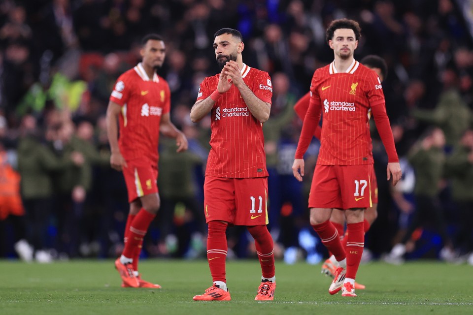 Liverpool players looking dejected after a match.
