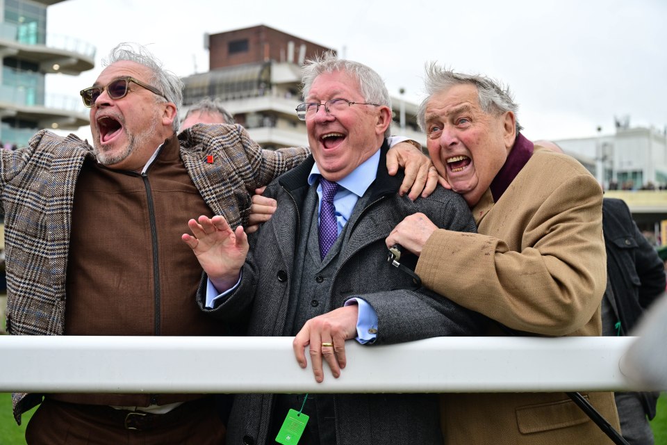 Sir Alex Ferguson and two other men celebrating at a horse race.
