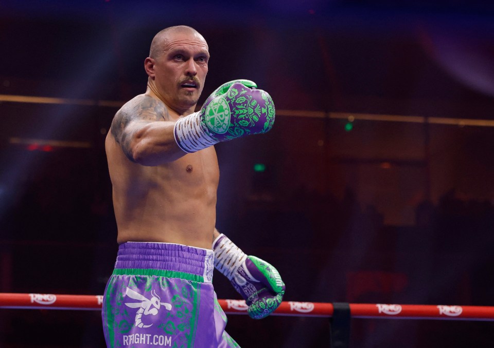 Oleksandr Usyk reacts during a boxing match.