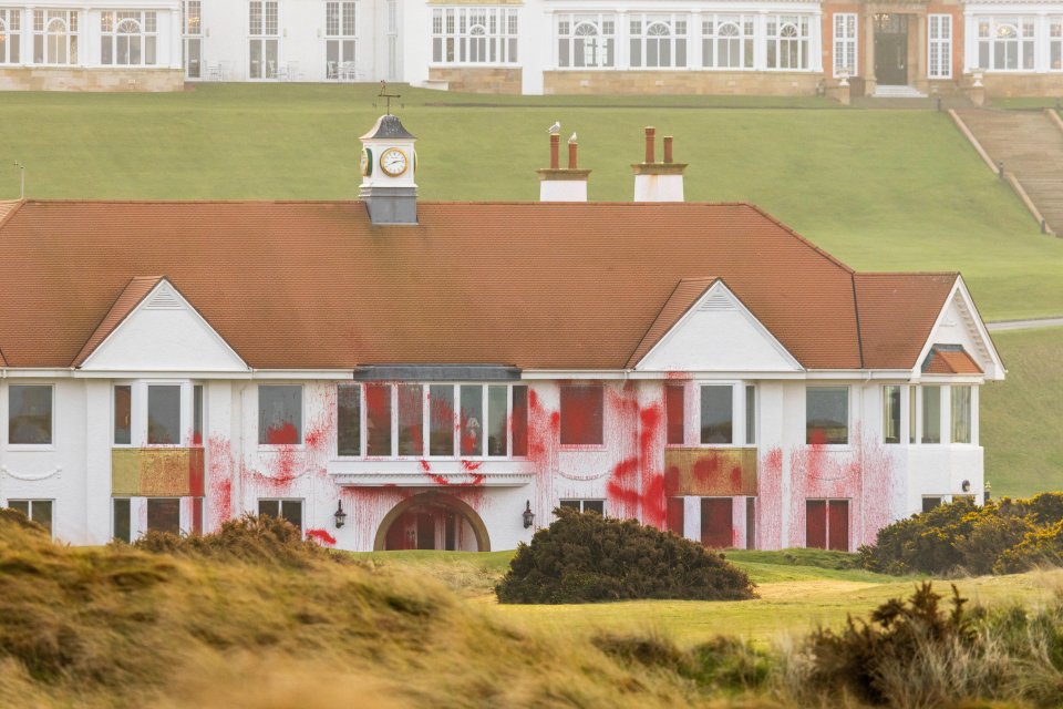 Red paint splattered on a clubhouse.
