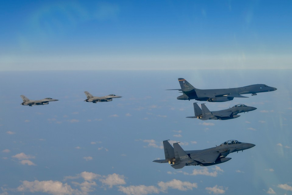 Photo of US and South Korean fighter jets conducting joint air drills.