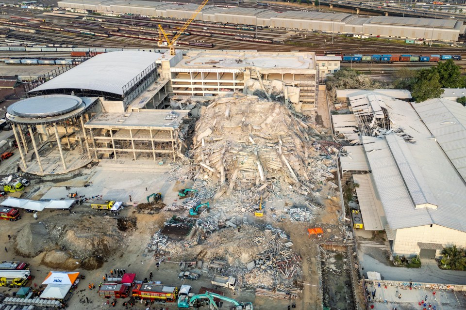 Aerial view of a collapsed building in Bangkok following an earthquake.