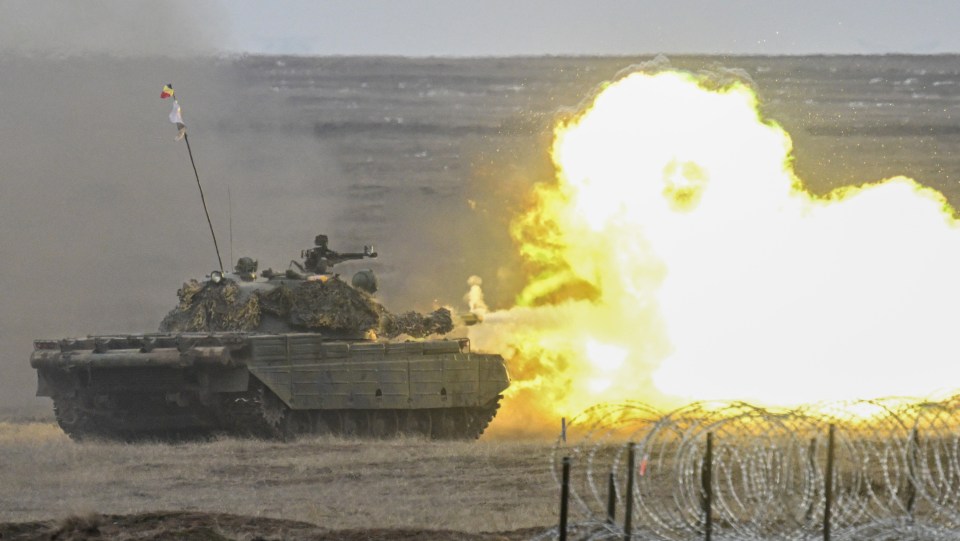 Romanian army tank firing during NATO exercise.