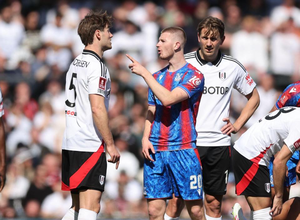 Soccer players arguing during a game.