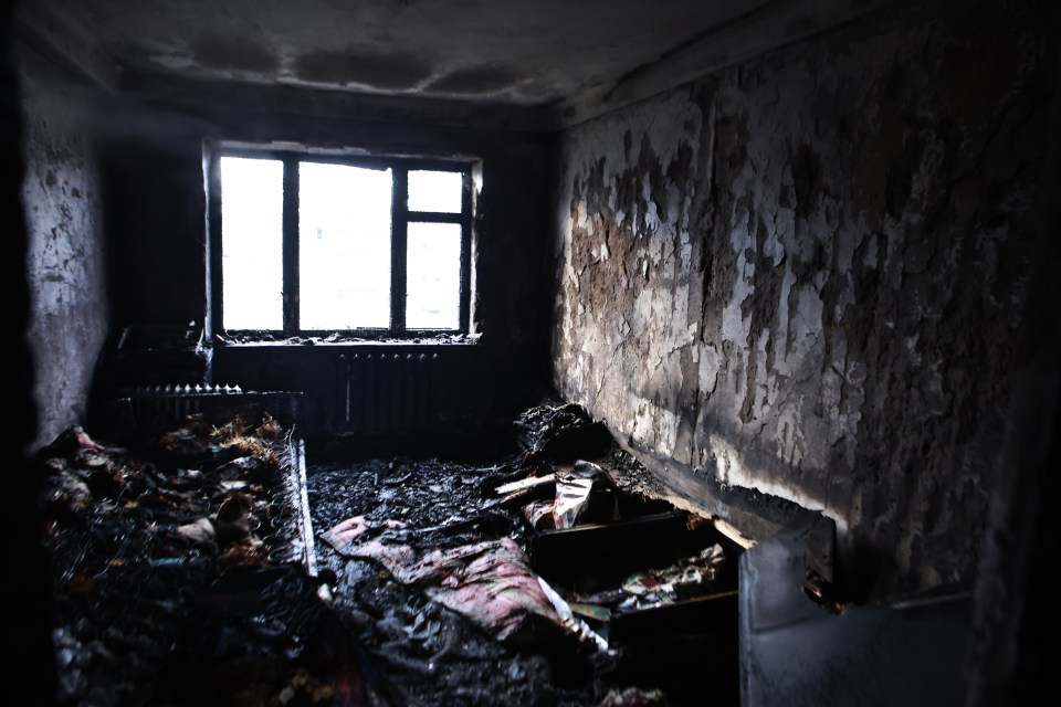 Fire damage inside a Kyiv apartment after a drone attack.