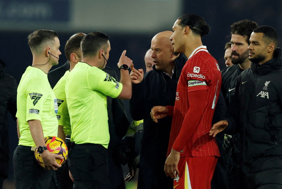 Liverpool manager Arne Slot arguing with a referee.