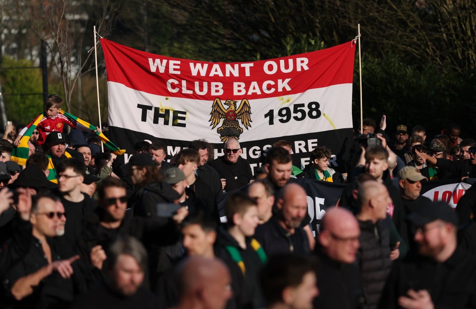 Manchester United fans holding a banner that reads "We Want Our Club Back" and "The 1958".
