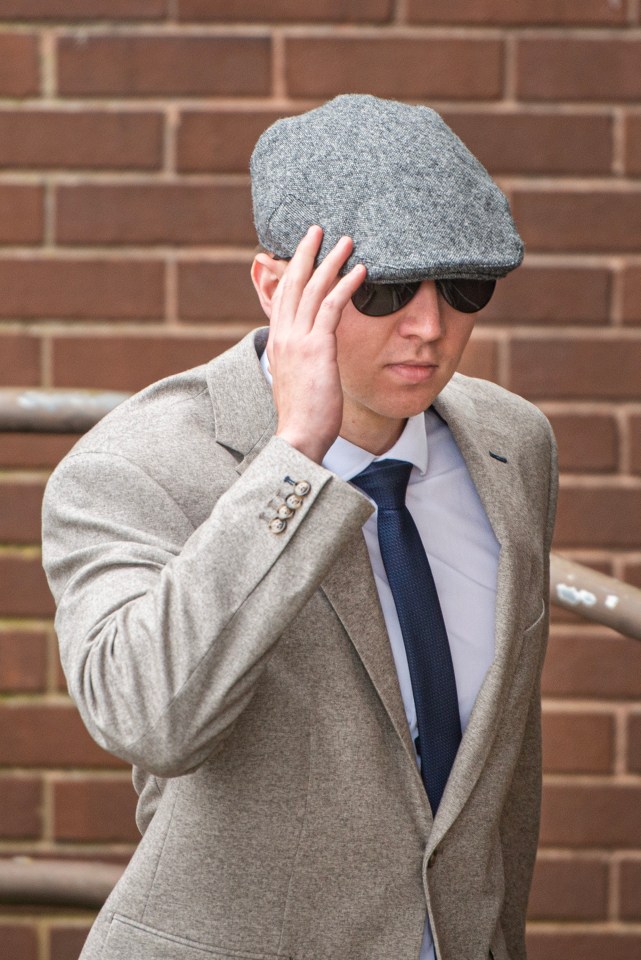 A man in a suit and flat cap appearing in court.
