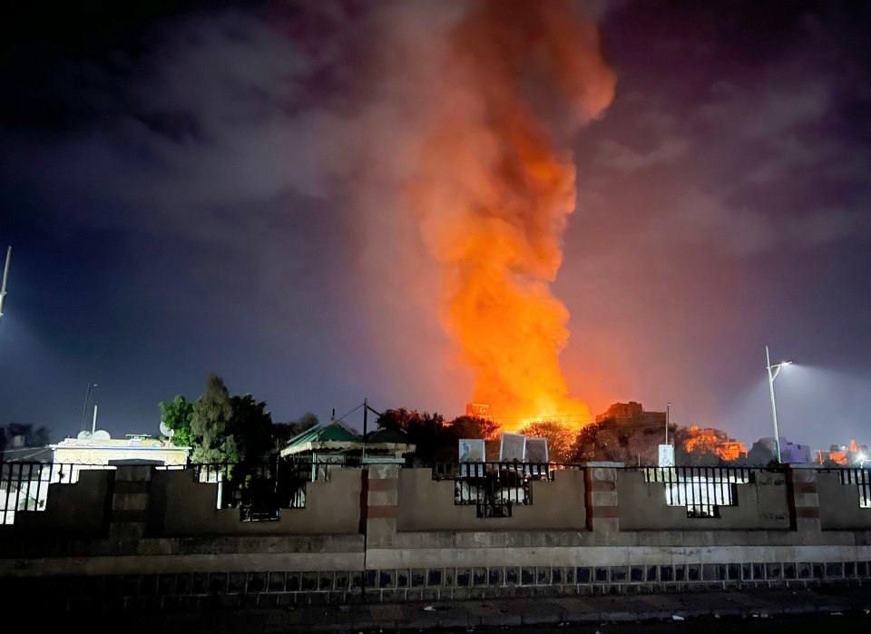 Smoke and fire rising from a Sanaa neighborhood after an airstrike.