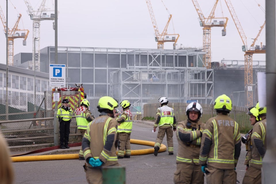 Firefighters at Heathrow Airport after a fire at an electrical substation.