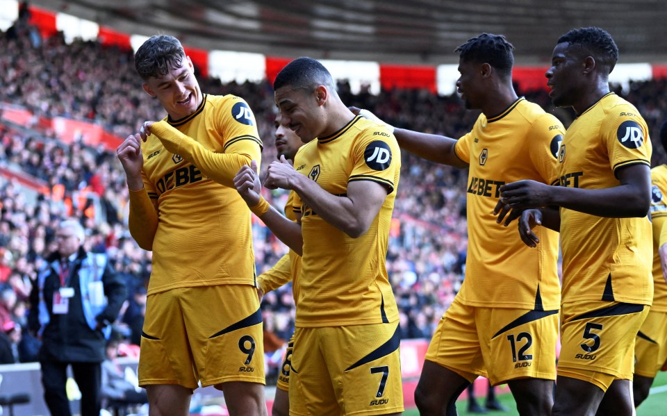 Wolverhampton Wanderers players celebrating a goal.