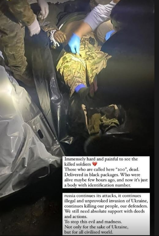Ukrainian frontline medics treating a deceased soldier.