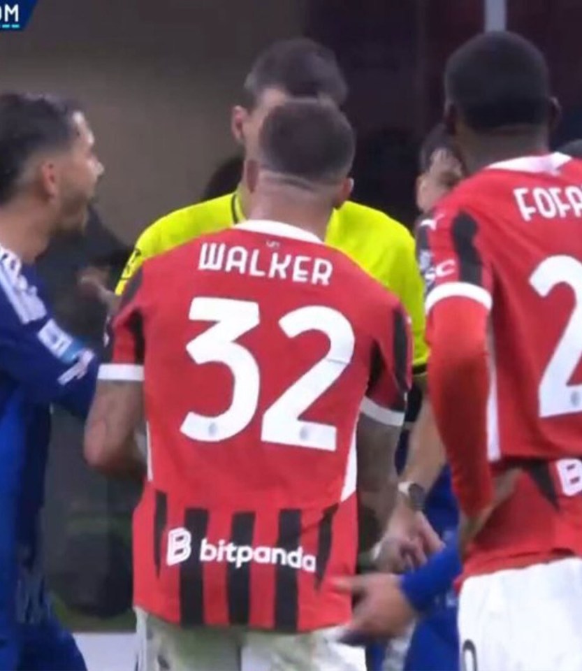 Soccer players arguing after a foul.