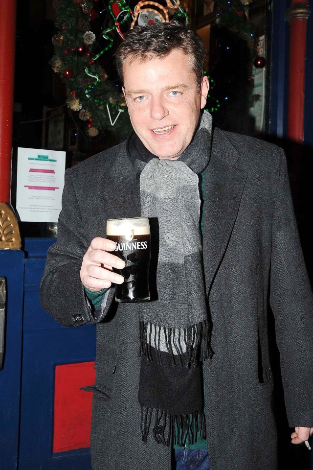 Graham McPherson holding a pint of Guinness.