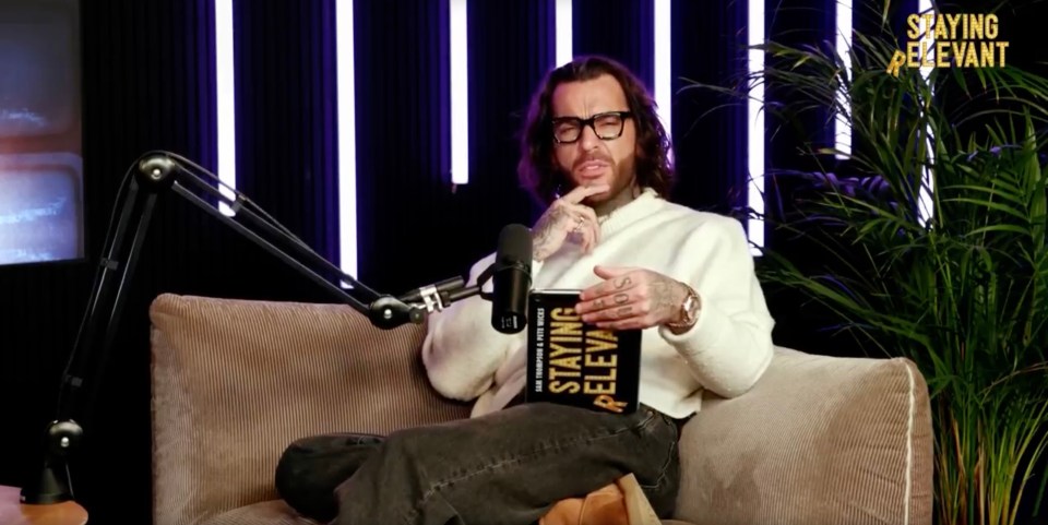 Pete Wicks holding his book, "Staying Relevant."