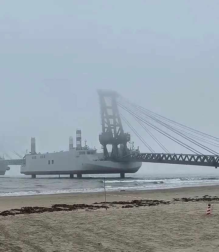 Large barge near a beach.