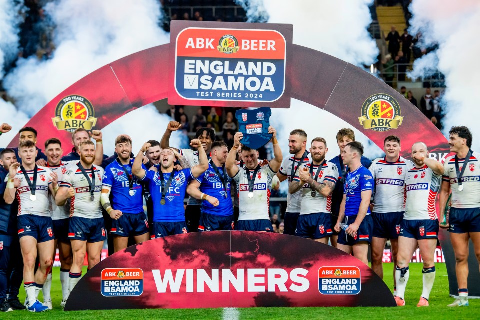 England rugby team celebrating their win over Samoa.