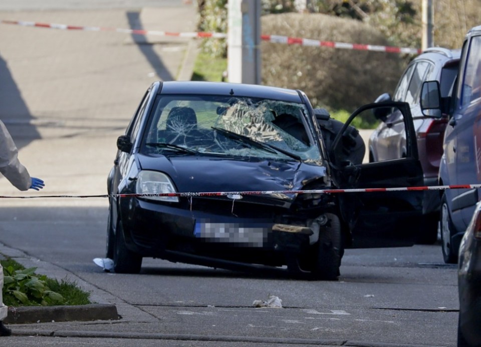 epa11938023 A damaged car at the scene after a vehicle was driven to pedestrians in Mannheim, Germany, 03 March 2025. According to statements from police, a vehicle drove into a crowd in the Mannheim city centre, killing one person and injuring several others. EPA/RONALD WITTEK