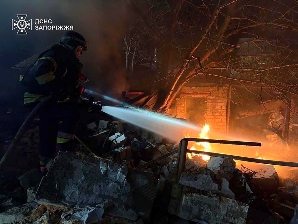 epa11979916 A handout picture made available by the State Emergency Service shows Ukrainian rescuers working at the site of a drone attack in Zaporizhzhia, Ukraine, late 21 March 2025 amid the ongoing Russian invasion. At least two people died and four others were injured according to the State Emergency Service. EPA/STATE EMERGENCY SERVICE HANDOUT HANDOUT EDITORIAL USE ONLY/NO SALES