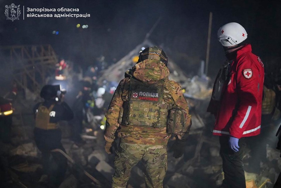 epa11979918 A handout picture made available by the Zaporizhzhia Regional Military Administration shows Ukrainian rescuers working at the site of a drone attack in Zaporizhzhia, Ukraine, late 21 March 2025 amid the ongoing Russian invasion. At least two people died and four others were injured according to the State Emergency Service. EPA/ZAPORIZHZHIA REGIONAL MILITARY ADMINISTRATION HANDOUT HANDOUT EDITORIAL USE ONLY/NO SALES