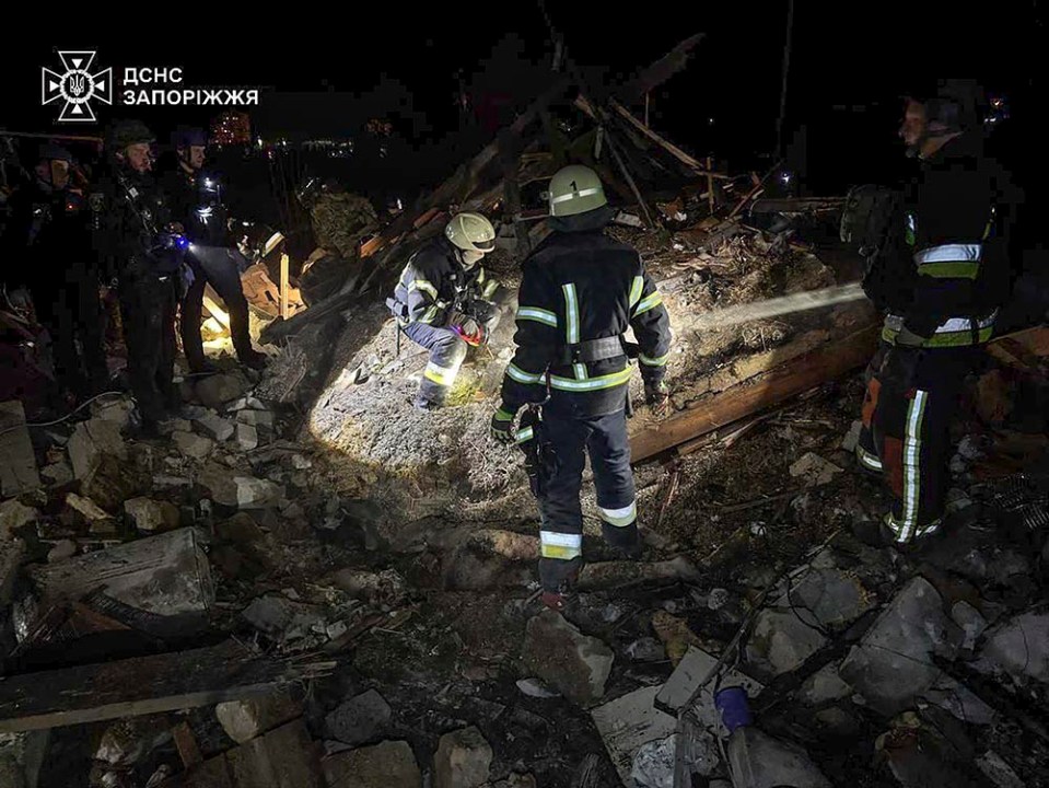 epa11979921 A handout picture made available by the State Emergency Service shows Ukrainian rescuers working at the site of a drone attack in Zaporizhzhia, Ukraine, late 21 March 2025 amid the ongoing Russian invasion. At least two people died and four others were injured according to the State Emergency Service. EPA/STATE EMERGENCY SERVICE HANDOUT HANDOUT EDITORIAL USE ONLY/NO SALES