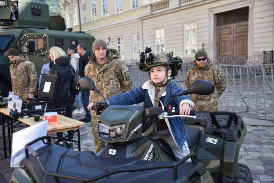 LVIV, UKRAINE - MARCH 22: People explore the equipment and tools of the State Border Guard Service of Ukraine during a public recruitment event at Rynok Square in Lviv, Ukraine on March 22, 2025. The event aimed to showcase the role of border guards in protecting Ukraine's borders and their involvement in the ongoing Russian-Ukrainian war, while encouraging citizens to join the service. (Photo by Michael Sorrow/Anadolu via Getty Images)