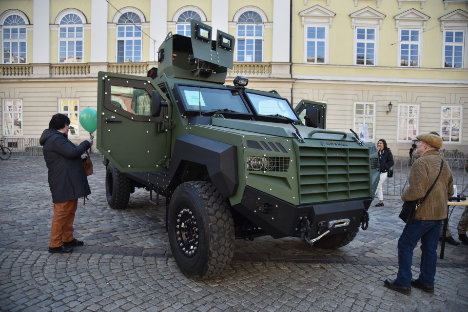 LVIV, UKRAINE - MARCH 22: People explore the equipment and tools of the State Border Guard Service of Ukraine during a public recruitment event at Rynok Square in Lviv, Ukraine on March 22, 2025. The event aimed to showcase the role of border guards in protecting Ukraine's borders and their involvement in the ongoing Russian-Ukrainian war, while encouraging citizens to join the service. (Photo by Michael Sorrow/Anadolu via Getty Images)