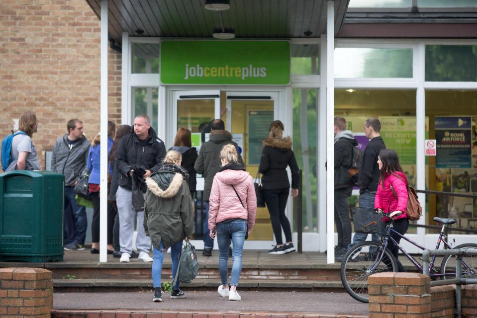 People waiting outside a Jobcentre Plus.