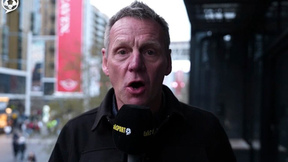 Man speaking into a microphone.