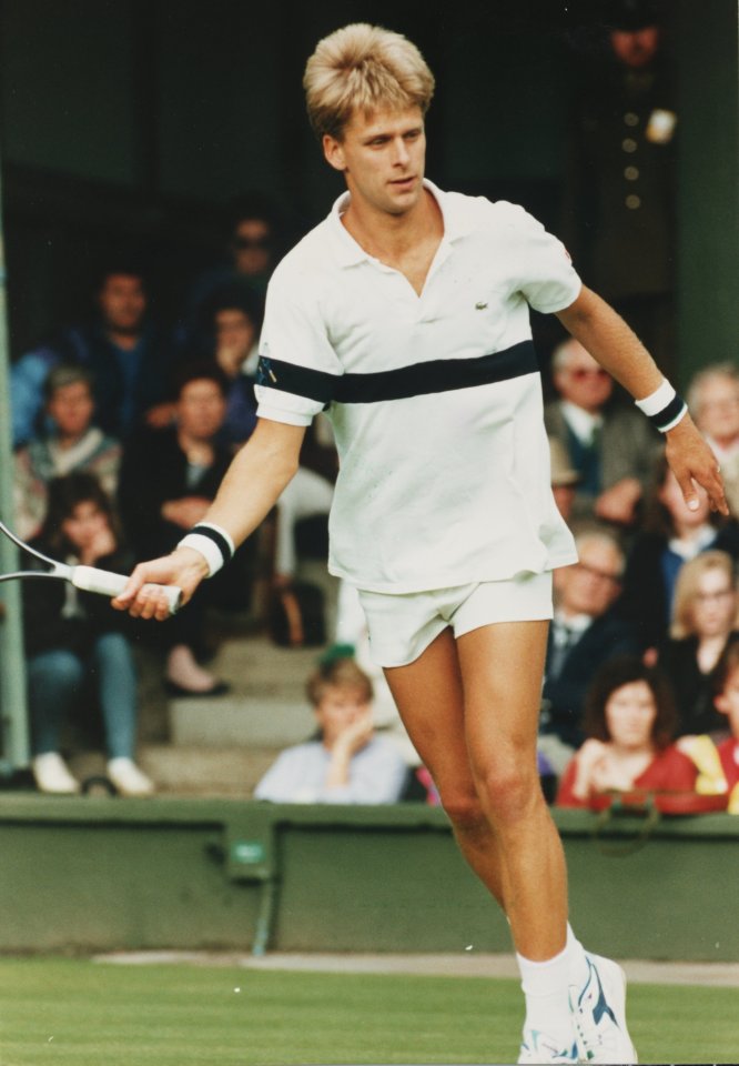 Andrew Castle playing tennis at Wimbledon.