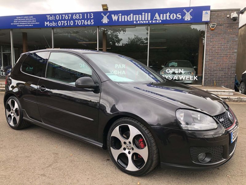Black Volkswagen Golf GTI at Windmill Autos dealership.
