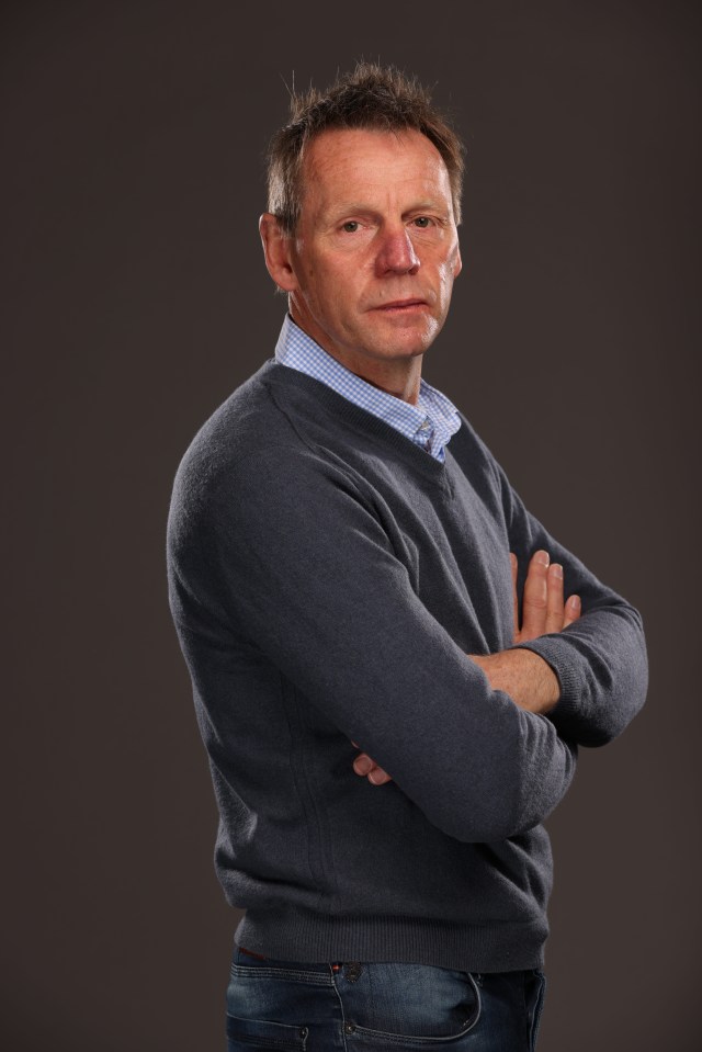 Portrait of Stuart Pearce with arms crossed.