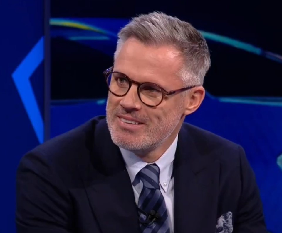 Man in suit and glasses smiling.