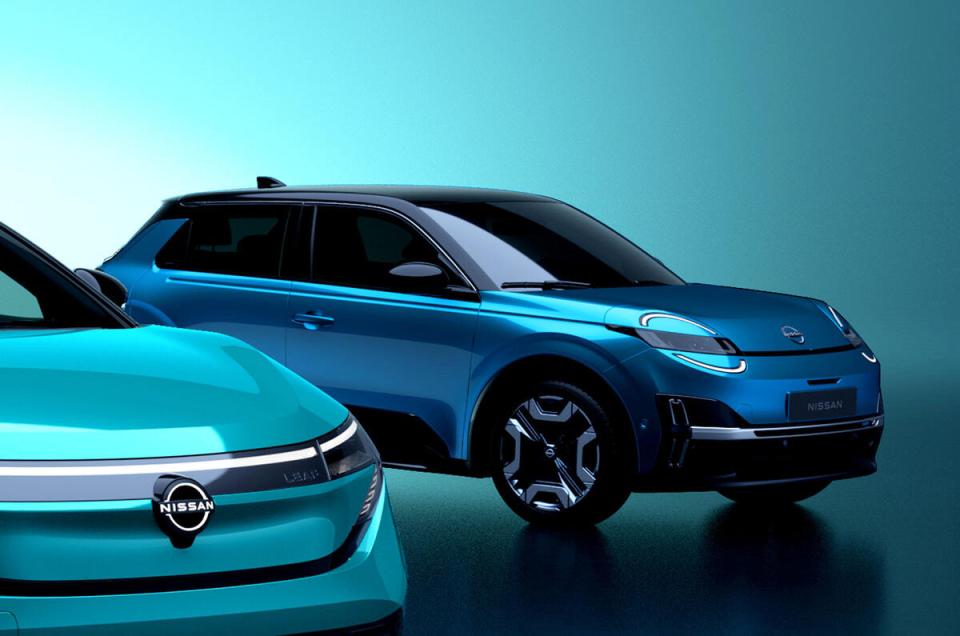 Two teal Nissan electric cars.