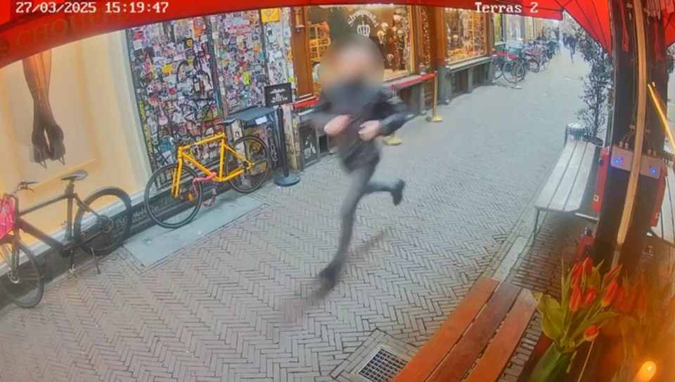 Security camera footage of a suspect running away.