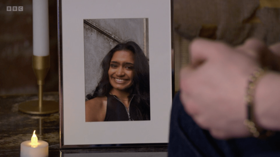 Framed photo of a smiling young woman.