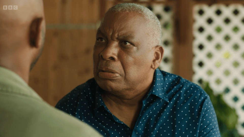 Screenshot of two men in conversation.