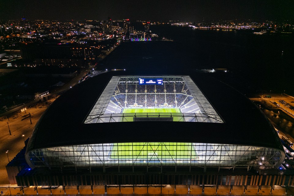 Aerial view of Everton's Bramley Moore Dock stadium at night.