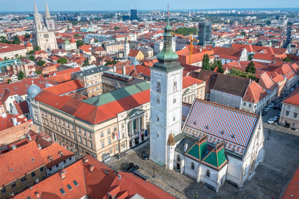 Aerial view of Zagreb's Upper Town, featuring St. Mark's Church and Zagreb Cathedral.