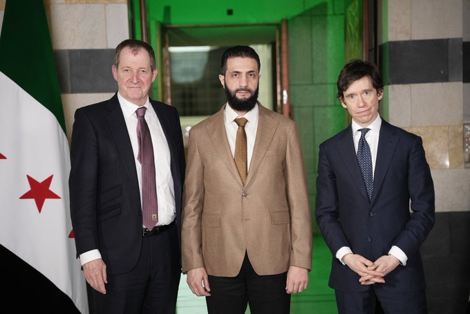 Ahmed al-Sharaa with Alastair Campbell and Rory Stewart.