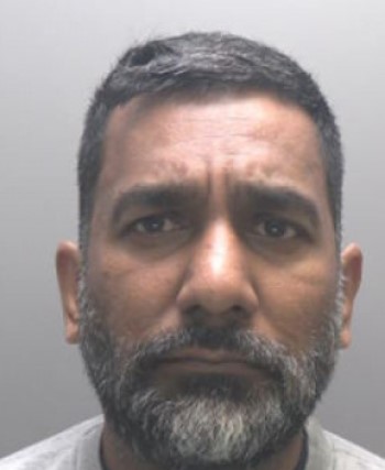 Mugshot of Anopkumar Maudhoo, a serial fraudster.