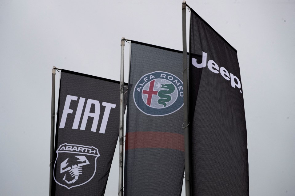 Flags displaying Fiat, Abarth, Alfa Romeo, and Jeep logos.