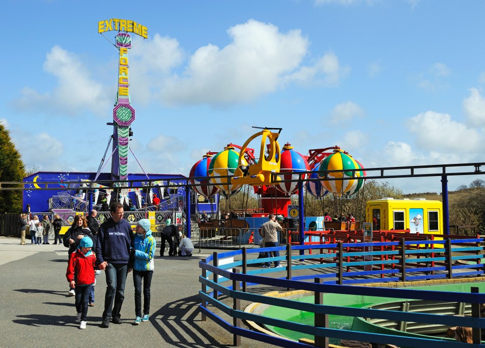 Families enjoying rides at a fun park.