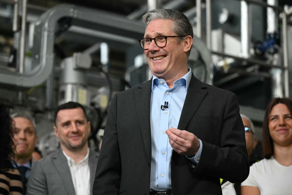 Keir Starmer speaking at a factory.