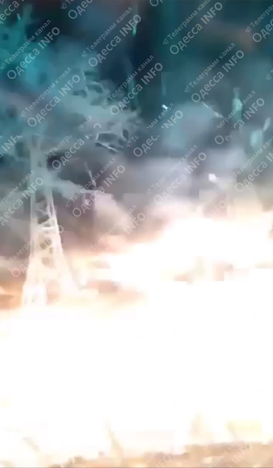 A blurry image of a Russian drone hitting a car in Odessa.