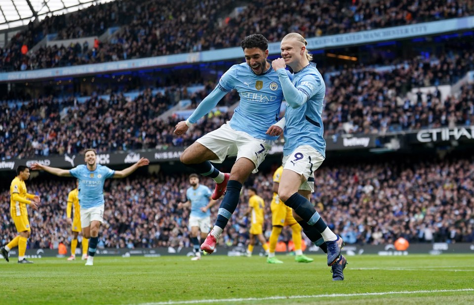 Erling Haaland and Omar Marmoush celebrating a goal.