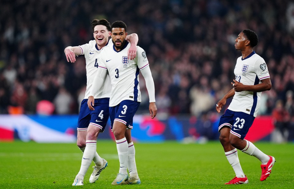 England soccer players celebrating a goal.