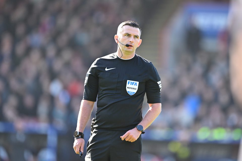 Referee Michael Oliver at a soccer match.